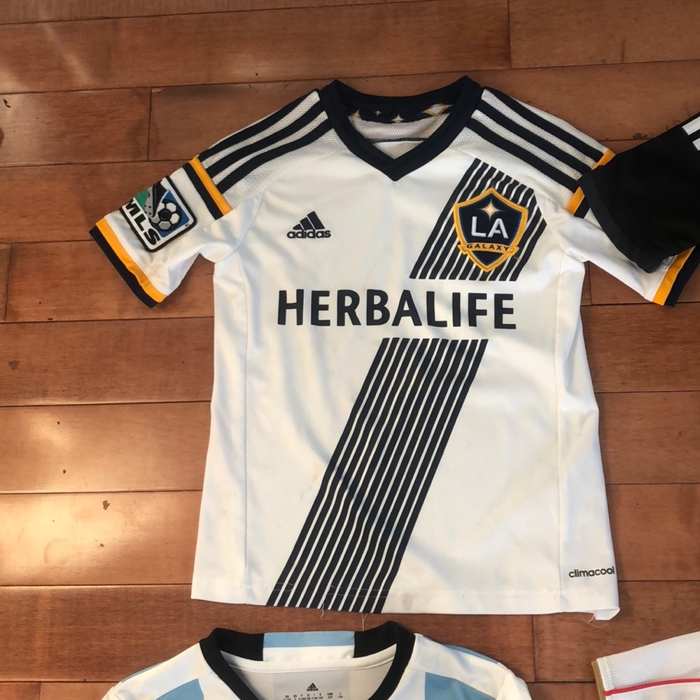 8 kids soccer jerseys fair condition.
